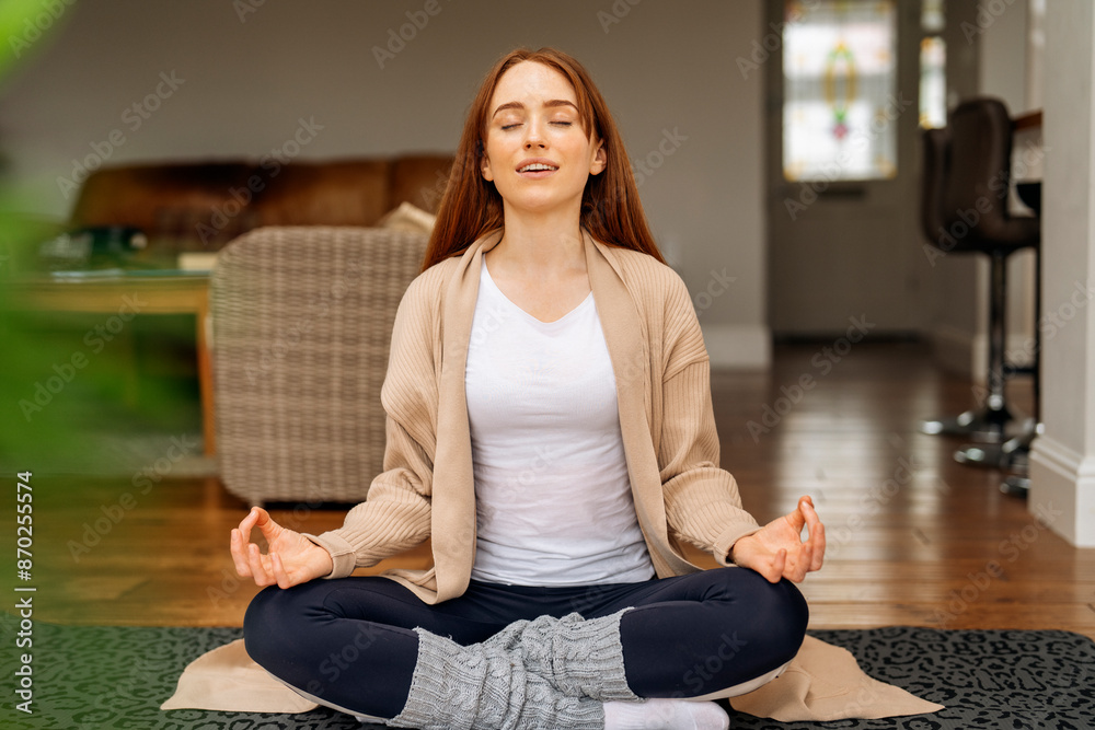 Woman Meditating in Modern Home During Day