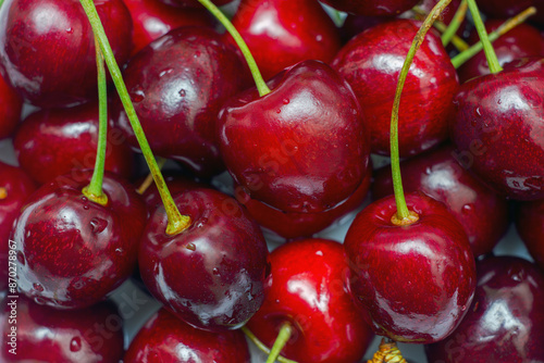Large ripe red cherry with green stems