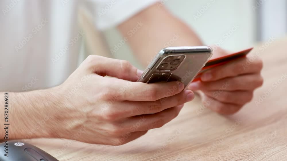hand with credit card and mobile phone hand with credit card and mobile phone