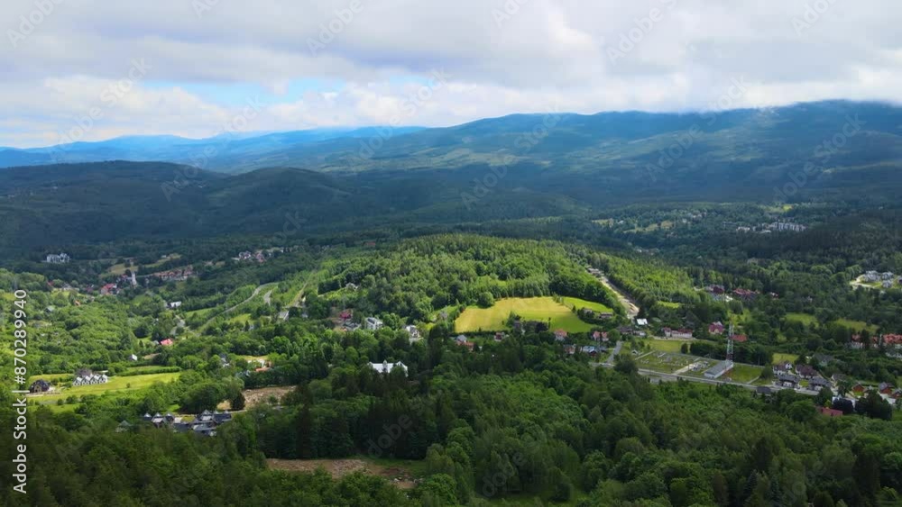 Aerial view of a village in the mountains forest of Germany on a sunny day Aerial view of a village in the mountains forest of Germany on a sunny day