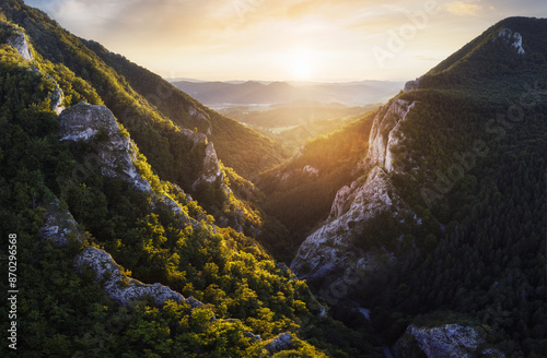 Mountain sunset landscape at sunset with sun and rock valley, Slovakia, Maninska Tiesnava photo