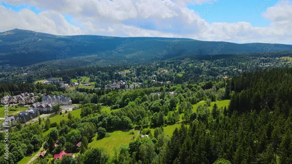 Aerial view of a village in the mountains forest of Germany on a sunny day Aerial view of a village in the mountains forest of Germany on a sunny day