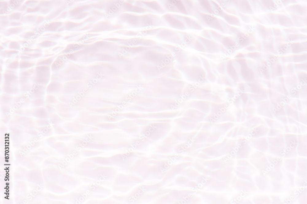 Fototapeta premium White water with ripples on the surface. Defocus blurred transparent white colored clear calm water surface texture with splashes and bubbles. Water waves with shining pattern texture background.