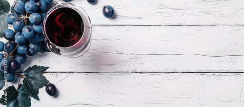 Red wine glass and blue gra...