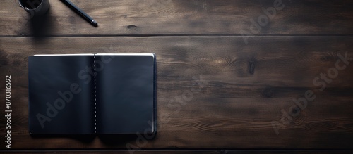Dark desk background with a...