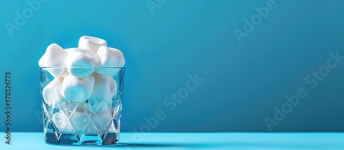 Marshmallows on blue holida...