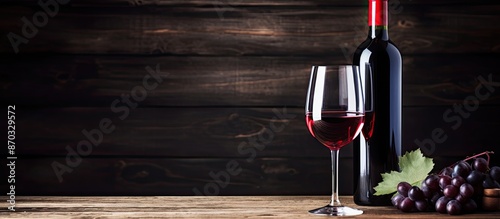 Red wine in a glass and bot...