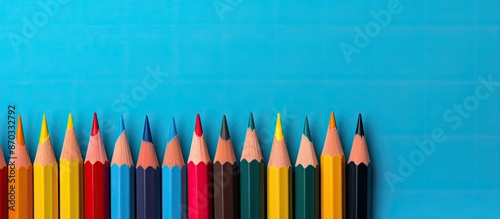 Colorful pencils lined up a...
