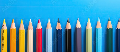 Colorful pencils lined up a...