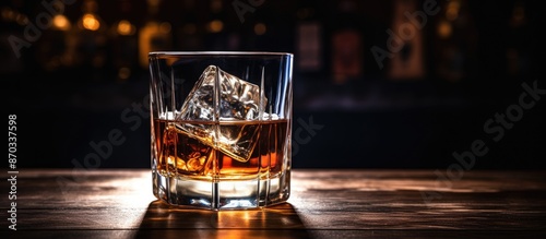 Elegant whiskey glass on a ...