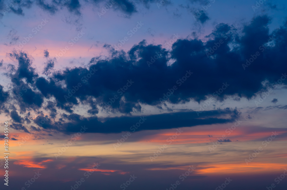 Dramatic dark moody blue and orange sunset sky. Natural background Dramatic dark moody blue and orange sunset sky. Natural background