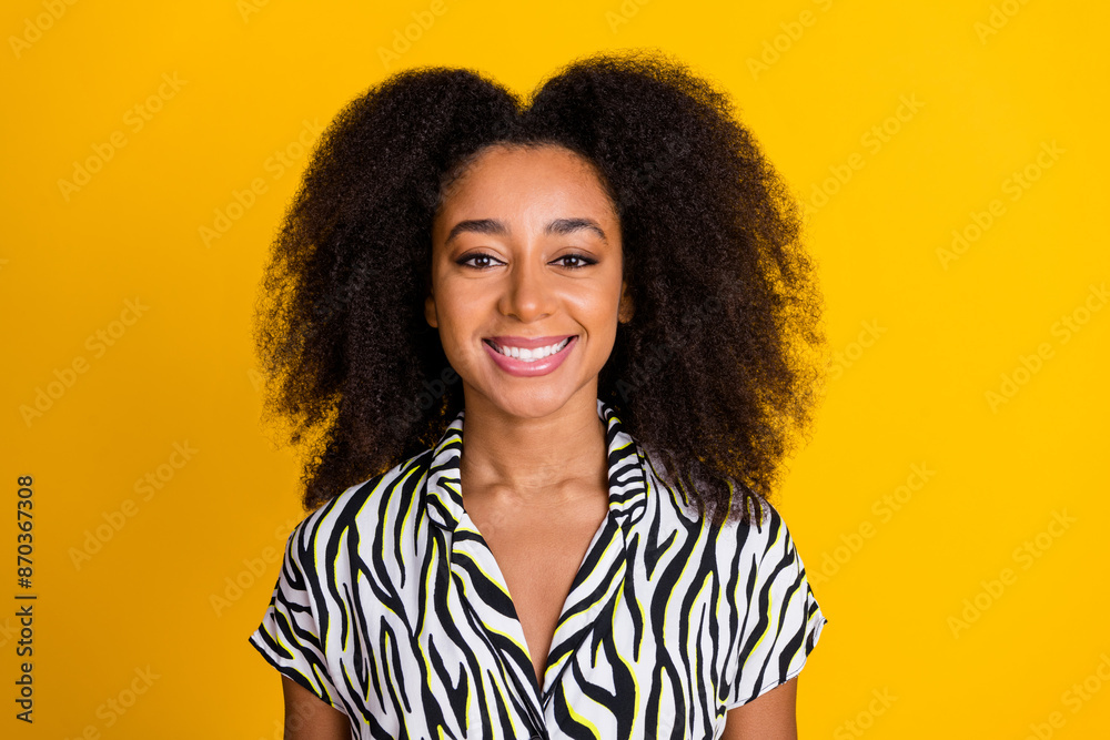 Portrait photo of young funky smiling girlfriend in zebra print shirt with beautiful curly hair isolated on yellow color background Portrait photo of young funky smiling girlfriend in zebra print shirt with beautiful curly hair isolated on yellow color background