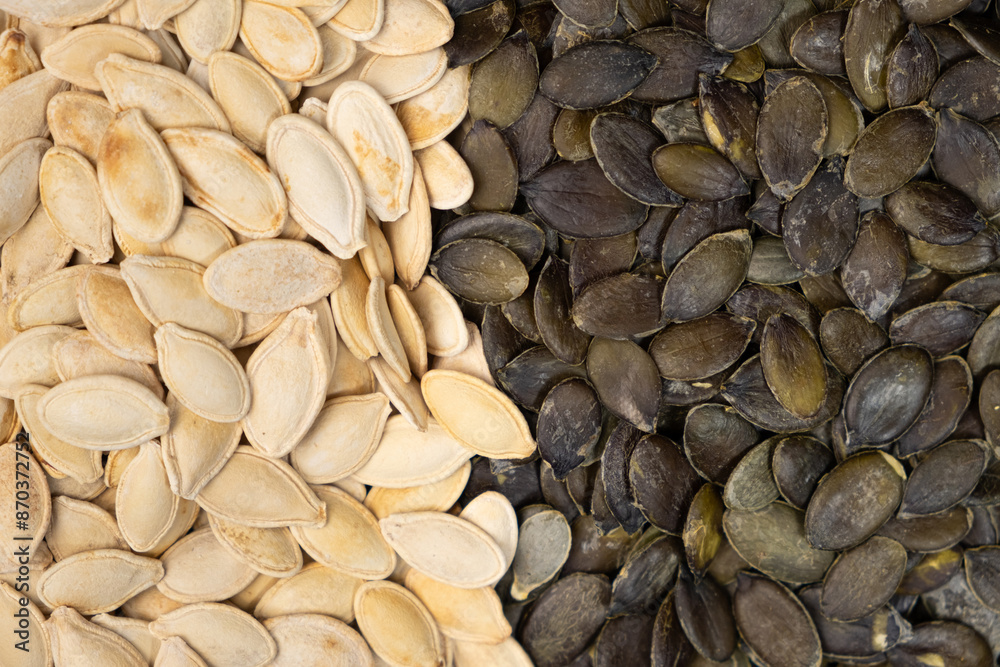 Unpeeled and peeled pumpkin seeds close-up, top view. Unpeeled and peeled pumpkin seeds close-up, top view.