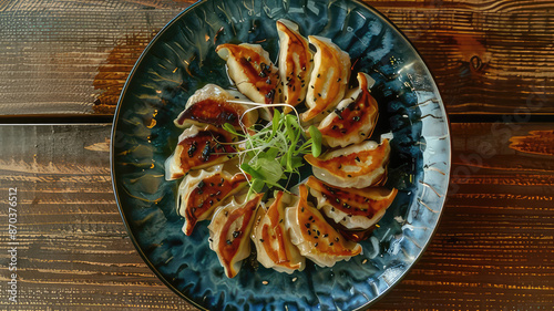 Plate of delicious crispy fried gyoza dumplings,  a popular Japanese cuisine dish, served on a rustic wooden table.