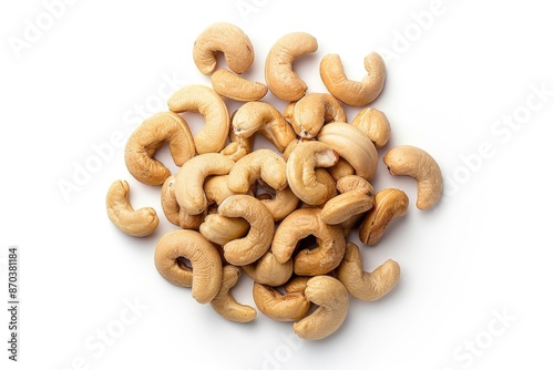 Unshelled roasted and salted cashew nuts isolated on white background top view