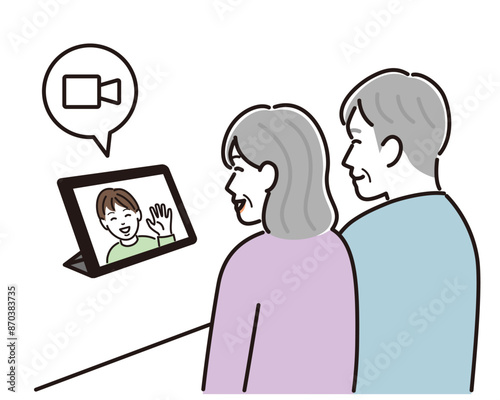 孫とビデオ通話する老夫婦