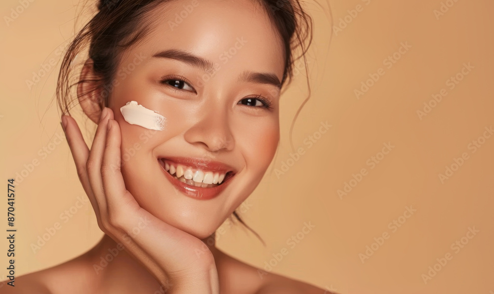 In a welllit studio, an attractive woman with radiant skin is applying skincare cream. Her healthy complexion reflects a regular skincare routine, enhancing her confidence and happiness In a welllit studio, an attractive woman with radiant skin is applying skincare cream. Her healthy complexion reflects a regular skincare routine, enhancing her confidence and happiness