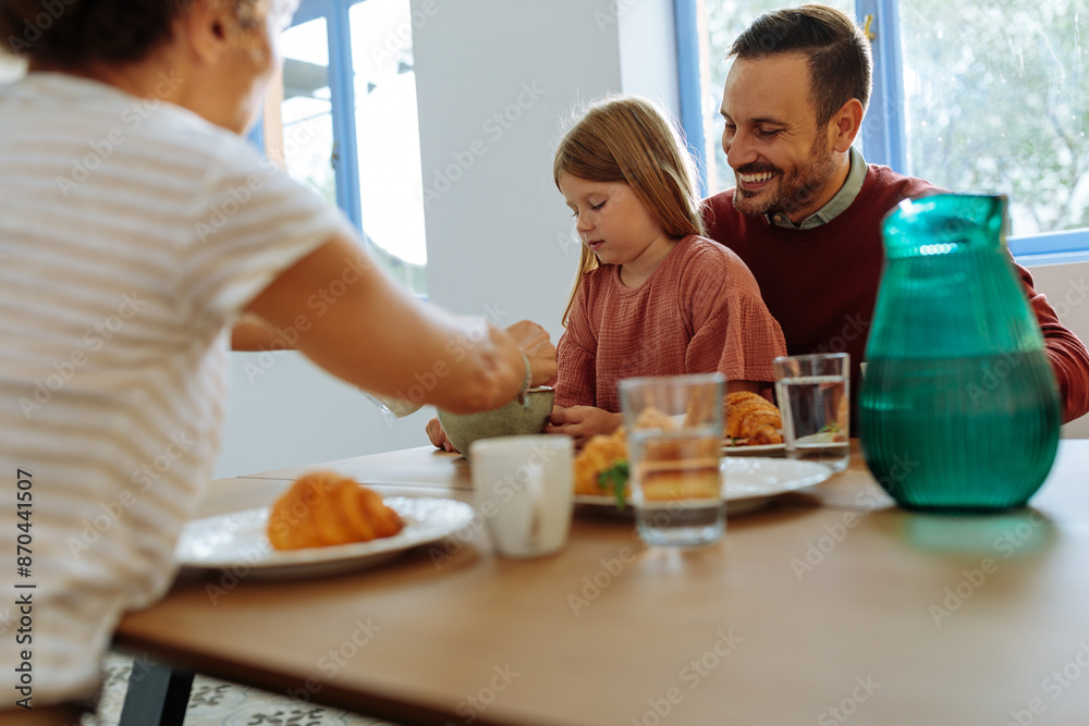Happy family having breakfast together Happy family having breakfast together
