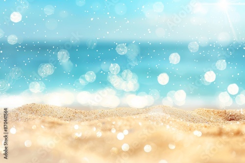 Seascape abstract beach background. Bokeh light of calm sea and sky. Focus on the sand foreground.