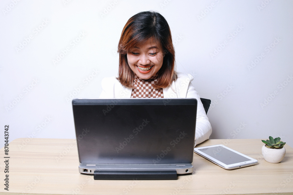 Happy Adult Asian Pyschologist Female Working Using Laptop At Office
Happy Adult Asian Pyschologist Female Working Using Laptop At Office