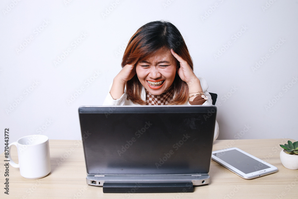Dizzy Asian Dentist Grown Woman Touching His Head While Looking At Laptop
Dizzy Asian Dentist Grown Woman Touching His Head While Looking At Laptop