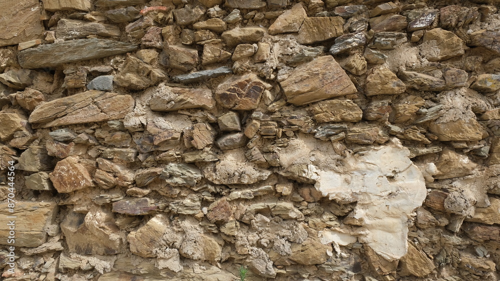 Fototapeta premium Textured wall. Rural construction area. Old form of housing