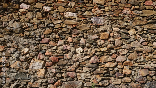 Textured wall. Rural construction area. Old form of housing