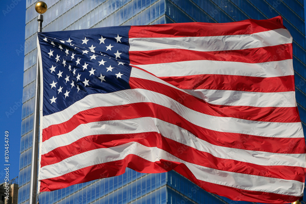 Fototapeta premium American flag fluttering in the wind. New York. USA.