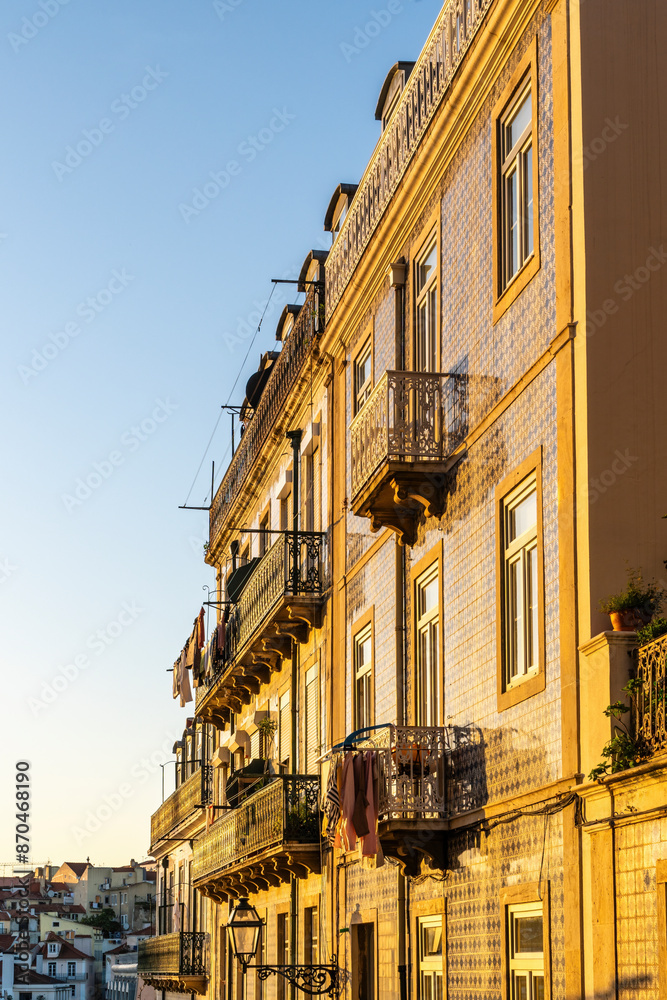 Obraz premium Street of Lisbon city. Washed clothes hang from the balcony and dry outside.