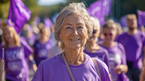 Obraz na płótnie A charity walk with participants of all ages wearing purple T-shirts and holding banners raising funds for Alzheimer's research. w salonie