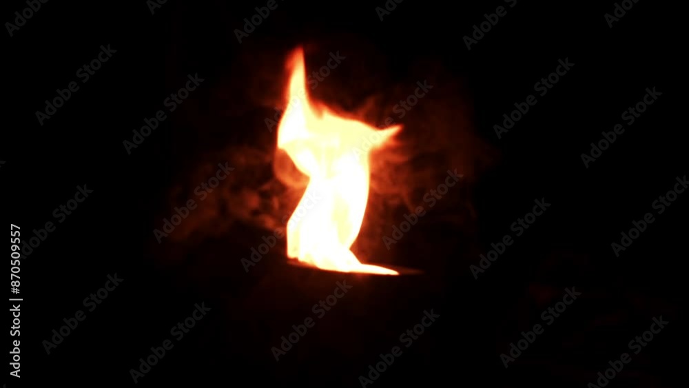 There is a big bonfire with people sitting around There is a big bonfire with people sitting around