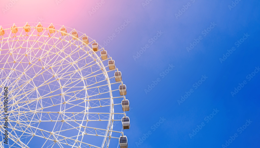 white ferris wheel on background a clear blue sky in Navruz Park in Tashkent with copy space white ferris wheel on background a clear blue sky in Navruz Park in Tashkent with copy space