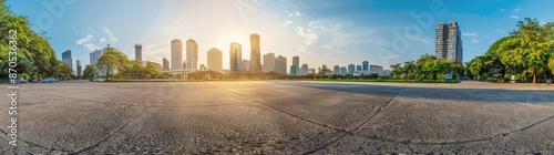 Empty asphalt road with city background © grigoryepremyan