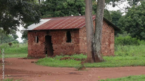 Redbrick home in rural area of Uganda, Africa. Handheld view photo