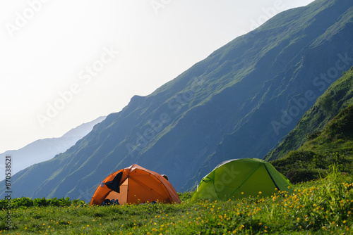 two beautiful tents against the background of mountains