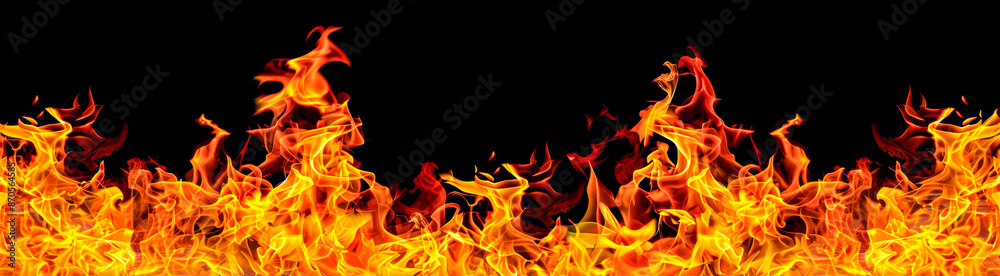 Fototapeta premium Flames dancing against a black background