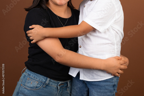 Latin american Family members hugging each other in a professional photo shoot family bonds love