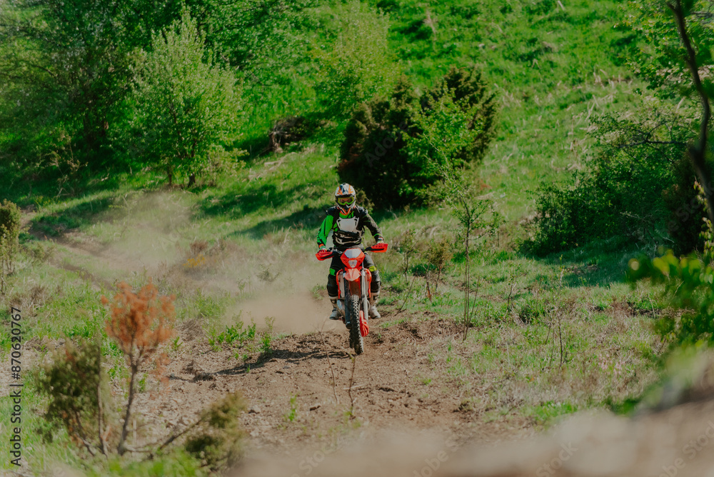 Naklejka premium Professional enduro bike riding dirt road. Motocross sport.