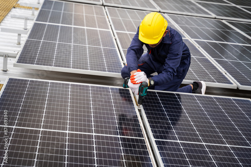Wallpaper Mural A technician maintain solar panels on a rooftop, ensuring optimal performance. Renewable energy maintenance and sustainability. Torontodigital.ca