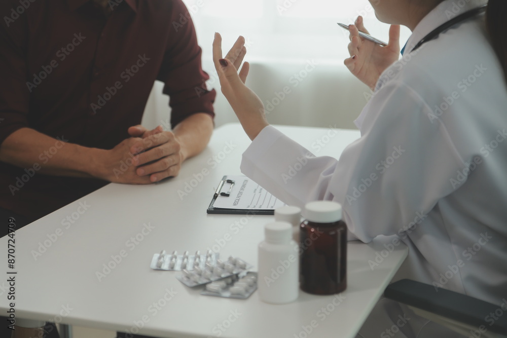 Doctor prescribing medicine giving pills to senior grandmother patient at hospital. Doctor prescribing medicine giving pills to senior grandmother patient at hospital.