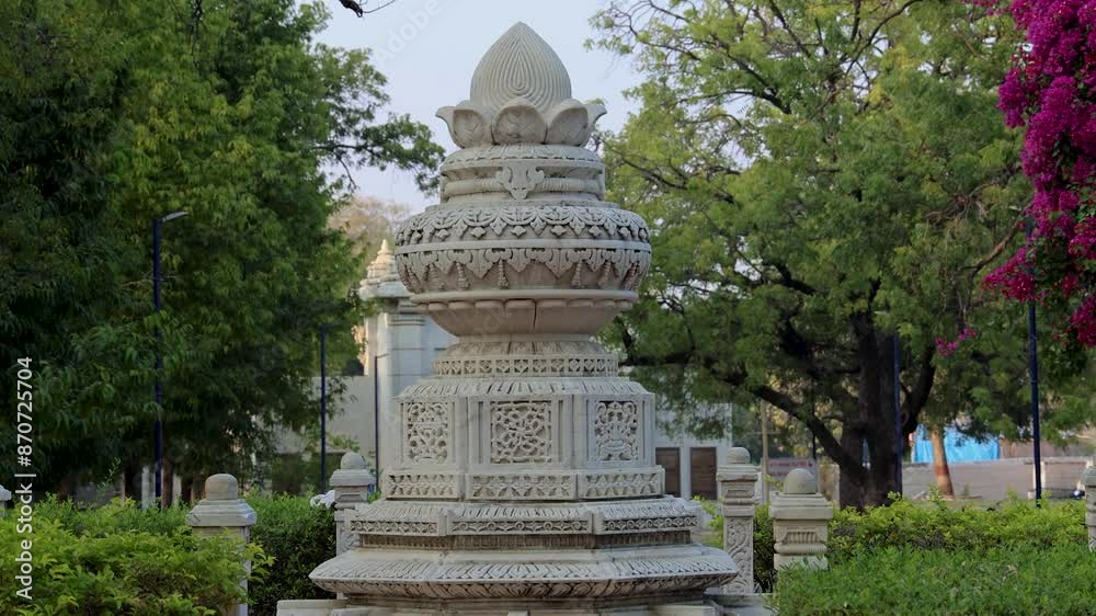 isolated jain holy marble pillars with unique art at day from flat angle isolated jain holy marble pillars with unique art at day from flat angle