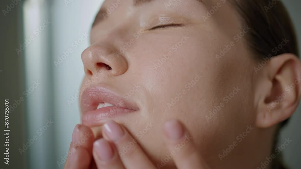 Closeup woman applying cream massaging face skin in morning. Natural beauty