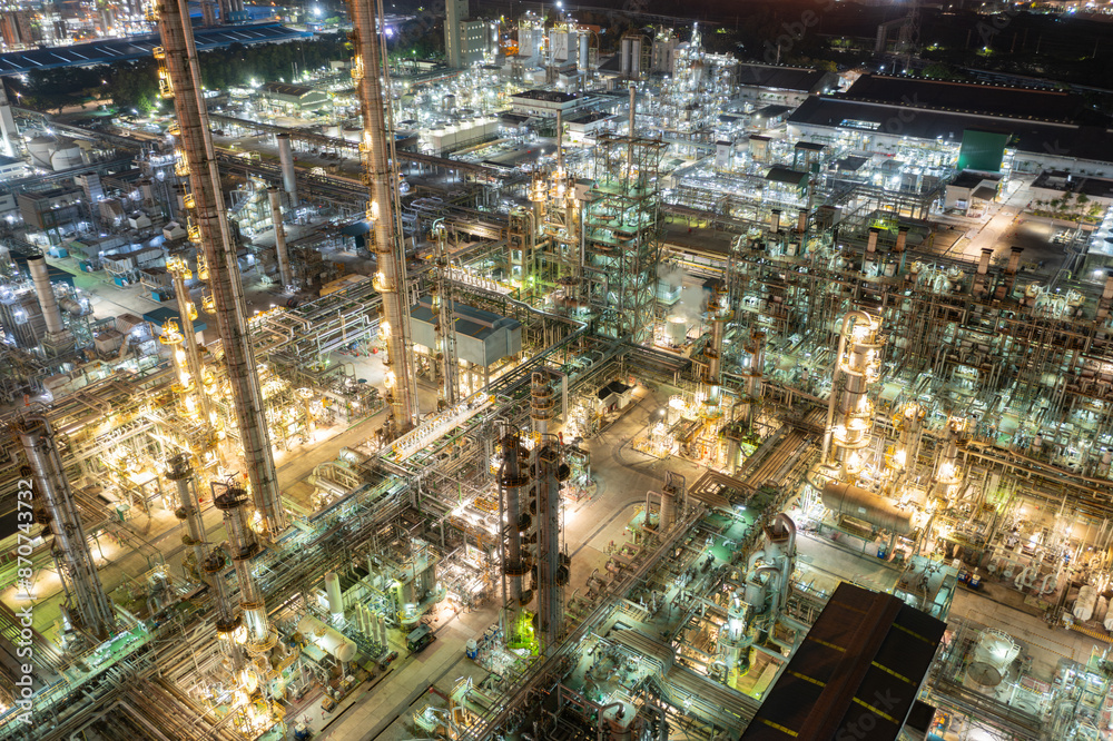Fototapeta premium Petroleum chemical factory illuminated at night
