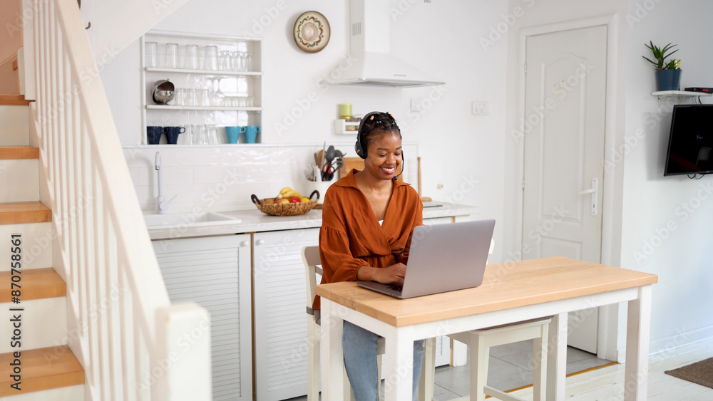 Young African American woman working online at her home office Young African American woman working online at her home office
