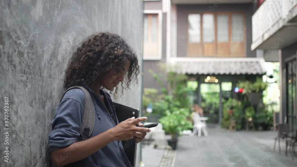 Young Black student woman is living in city. Young Black student woman is living in city.