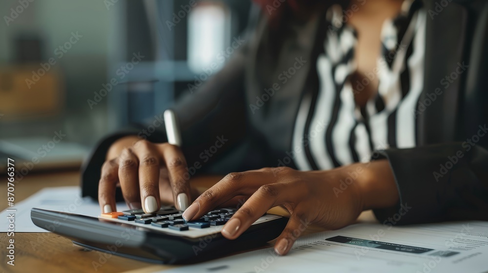 Close-up of a Woman's Hands Using a Calculator - A close-up shot of a woman's hands using a calculator, her nails are painted, she's wearing a black blazer with a black and white shirt underneath. - A Close-up of a Woman's Hands Using a Calculator - A close-up shot of a woman's hands using a calculator, her nails are painted, she's wearing a black blazer with a black and white shirt underneath. - A