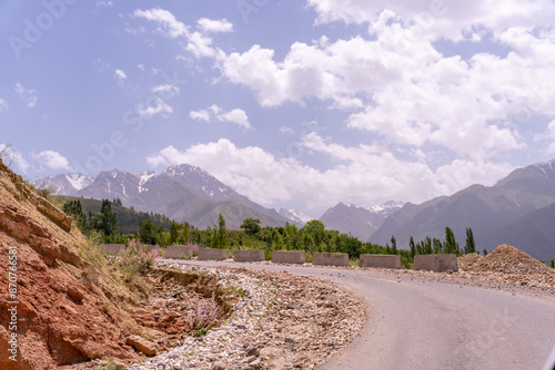 A mountain range is visible in the background photo