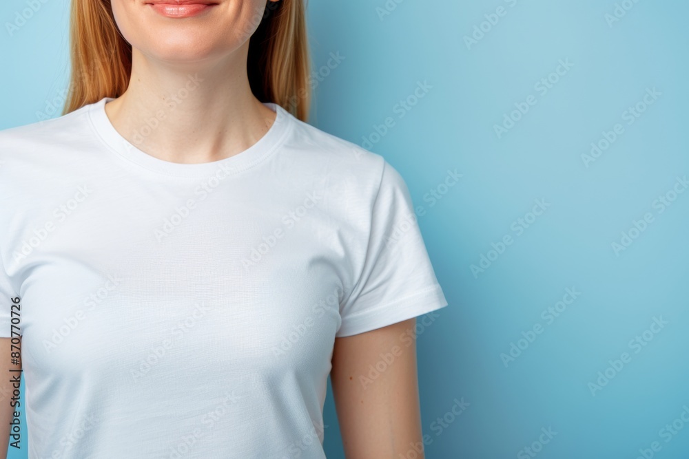 Smiling Woman Wearing White T-Shirt on Blue Background Smiling Woman Wearing White T-Shirt on Blue Background