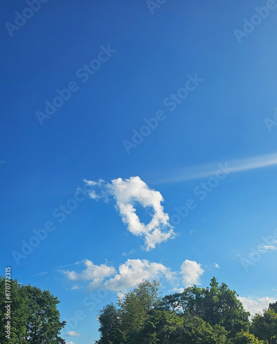 Heart shaped cloud in the blue sky