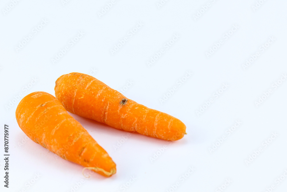 two fresh orange carrots on a white isolated background two fresh orange carrots on a white isolated background